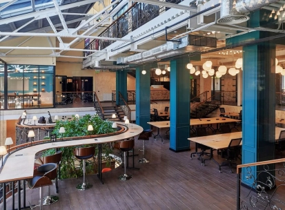 Creative States - modern workspace featuring high ceilings and long desks