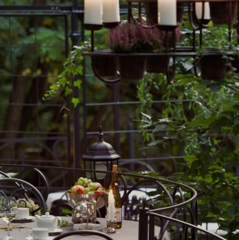 Terasa - elegant outdoor dining table with wine and fruit