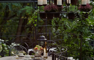 Terasa - elegant outdoor dining table with wine and fruit