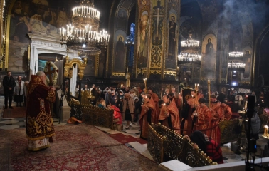 St. Volodymyr's Cathedral in Kyiv - liturgy service with priests in red robes and candles