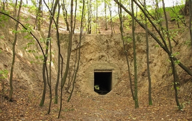 Lysa Hora in Kyiv - entrance to a dark brick tunnel built into the earthen fortification rampart