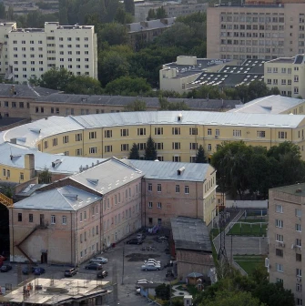 Kyiv Fortress in Kyiv - curved yellow historical building surrounded by modern architecture
