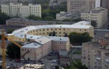 Kyiv Fortress in Kyiv - curved yellow historical building surrounded by modern architecture