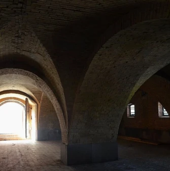 Kyiv Fortress in Kyiv - spacious vaulted dungeon hall with ancient brick arches
