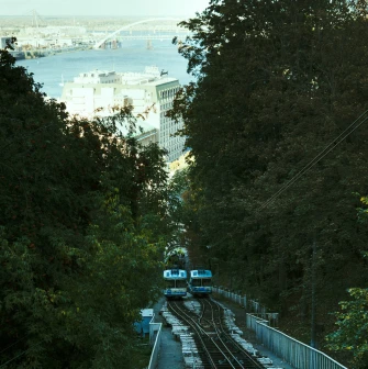 Kyiv Funicular - two carriages passing on tracks with a view of the Dnipro