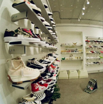 Shelves with sneakers of different brands in the Konyk.dept store