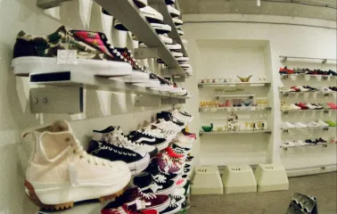 Shelves with sneakers of different brands in the Konyk.dept store