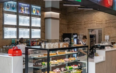 Restaurant Puzata Hata - dessert bar with a glass display case full of cakes and pastries