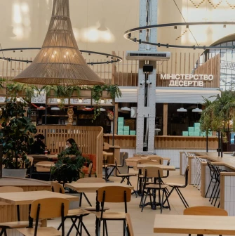 Bessarabskyi Market food hall interior with wooden tables