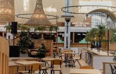 Bessarabskyi Market food hall interior with wooden tables