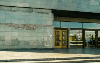War Museum in Kyiv - monumental stone facade with golden doors at the museum entrance