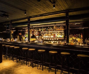 Bar counter with drinks at Hendrick's Bar in Kyiv