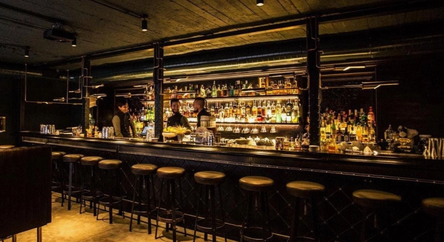 Bar counter with drinks at Hendrick's Bar in Kyiv