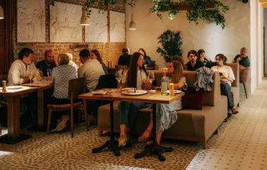 Restaurant Tisto, Syr i Titka Bella - indoor dining area with brick walls and stucco reliefs