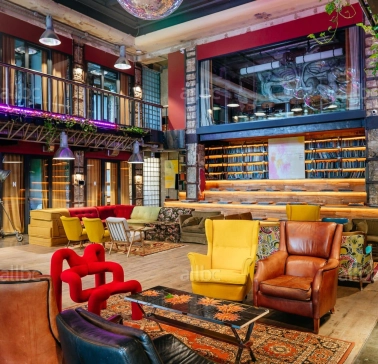 Bright lounge with colored chairs in the interior of Generator in Kyiv