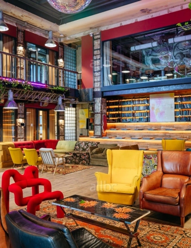 Bright lounge with colored chairs in the interior of Generator in Kyiv