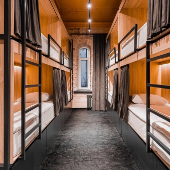 Globe Runner Hostel - corridor leading to hostel rooms with clear signage