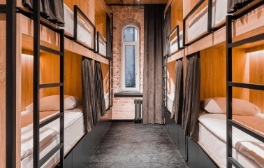 Globe Runner Hostel - corridor leading to hostel rooms with clear signage