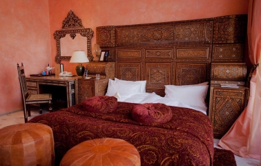 Opera Hotel - luxurious king-sized bed with rich fabrics