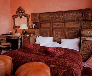 Opera Hotel - luxurious king-sized bed with rich fabrics