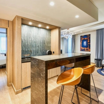 Modern room at the Radisson Blu Hotel in the center of Kyiv with double bed and designer furniture