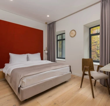 Sophia Hotel - close-up view of a large decorated bed with pillows