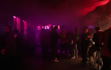 A party with dim lighting inside the "Hvlv" bar in Podil, Kyiv