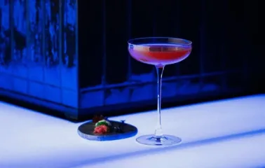 Sansara - close-up view of a unique cocktail served next to a small appetizer