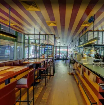 The Burger - contemporary restaurant interior featuring geometric lighting fixtures and set tables