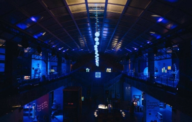 Science Museum at night with blue lighting and installations