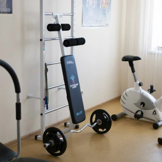 A small gym area with exercise bikes and strength equipment at the Bratyslava Hotel in Kyiv