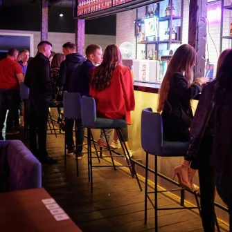 Bar counter and visitors inside the Sungrilla Beach venue