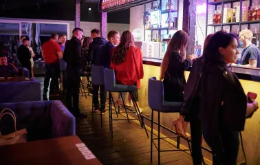 Bar counter and visitors inside the Sungrilla Beach venue