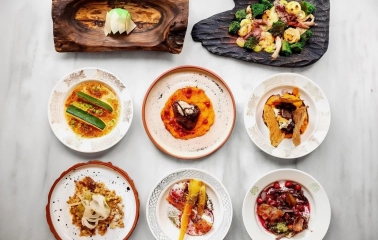 Restaurant 100 Rokiv Tomu Vpered - overhead view of a eight-course set menu on a marble table