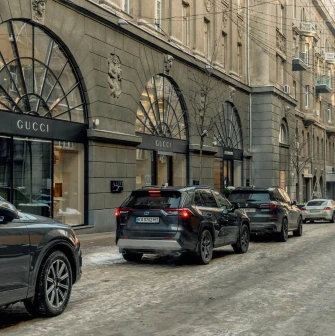 Street view of Passage with parked cars near luxury fashion boutiques in Kyiv