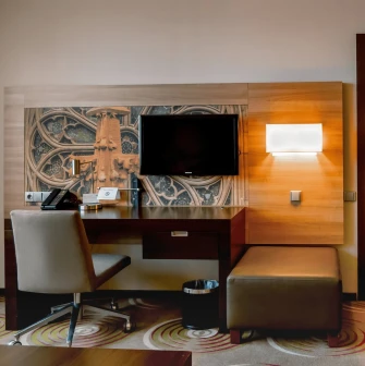 Work desk with a TV in a room at Holiday Inn Kyiv