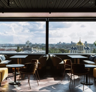 11 Mirrors Restaurant & Bar - seating area with large mirror and panoramic city view