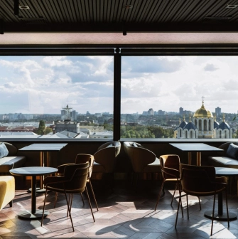11 Mirrors Restaurant & Bar - seating area with large mirror and panoramic city view