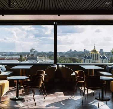 11 Mirrors Restaurant & Bar - seating area with large mirror and panoramic city view