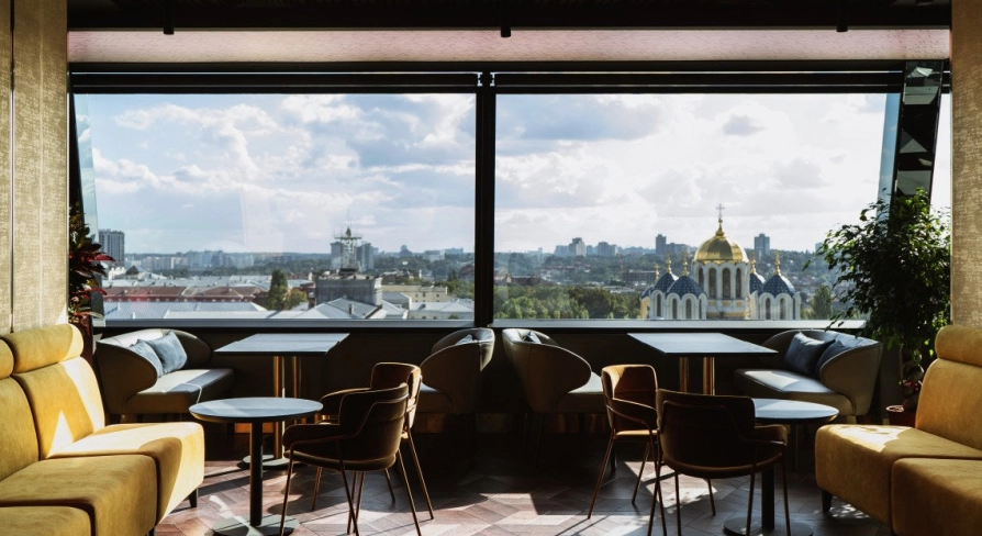 11 Mirrors Restaurant & Bar - seating area with large mirror and panoramic city view