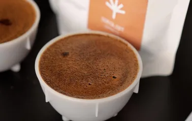 Idealist Coffee - close-up of a cup of freshly brewed coffee