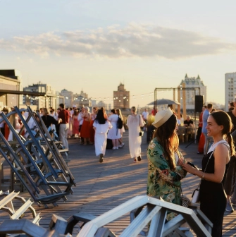 Kooperativ - multi-level outdoor terrace with greenery and seating areas