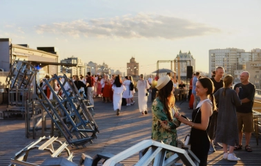 Kooperativ - multi-level outdoor terrace with greenery and seating areas