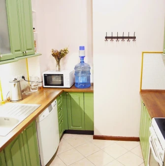 Kashtan Guest House - small, functional kitchen area with appliances and cabinets