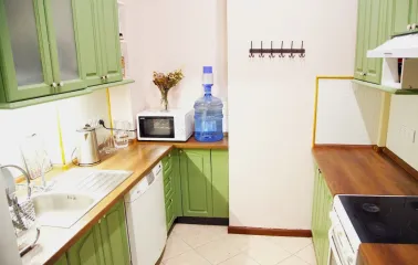 Kashtan Guest House - small, functional kitchen area with appliances and cabinets