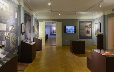 Muzei Ukrainskoi Diaspory in Kyiv - exhibition halls with grey walls and wooden parquet floors filled with historical narratives and artifacts