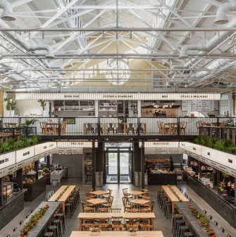 Kyiv Food Market main hall with wooden tables