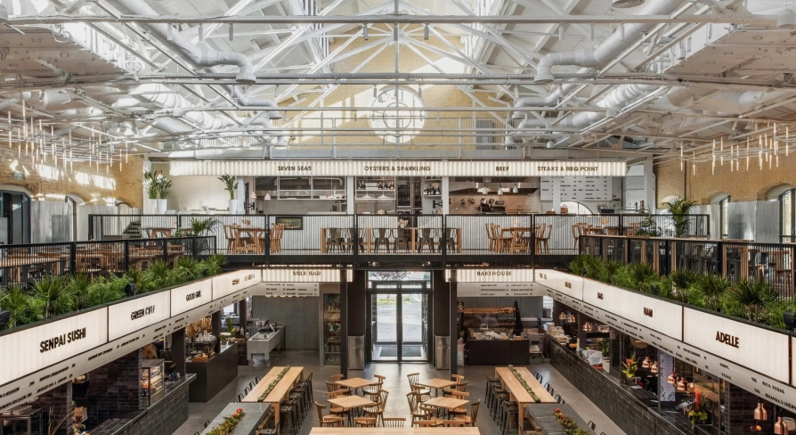 Kyiv Food Market main hall with wooden tables
