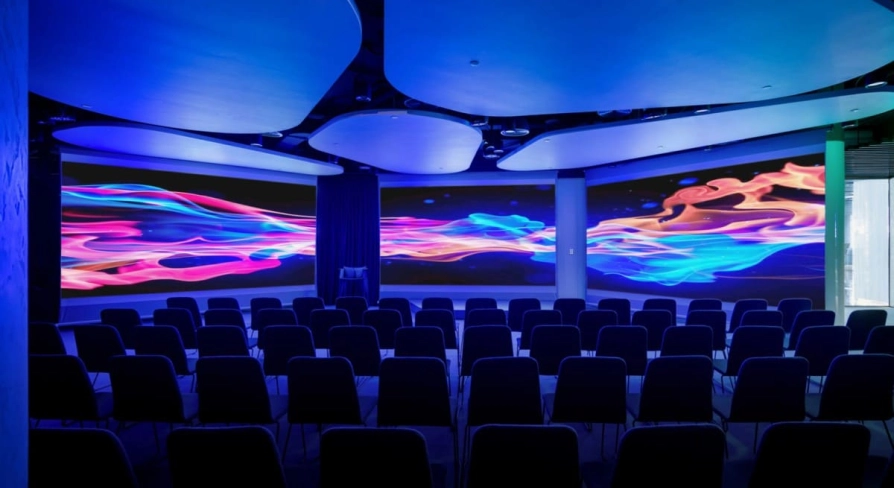 IQ Business Center in Kyiv - conference hall with rows of chairs and wide digital screens