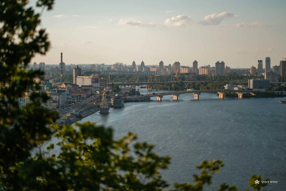 View of the Dnipro River and Poshtova Square in Kyiv from the glass bridge in Kyiv